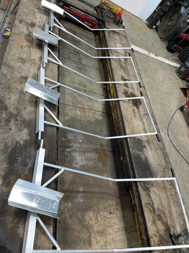 Four aluminium gig-rowing trollies ready to go out